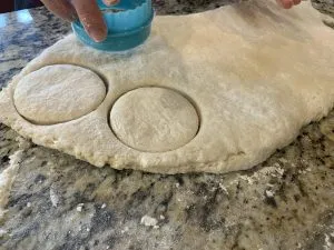 Cutting Grandma's homemade biscuits from dough on a granite countertop. Lexington KY bakery.
